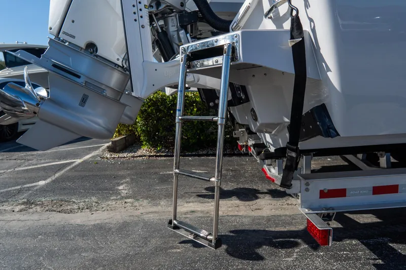 Slide: The Image of 2026 Tidewater 3100 Carolina Bay boat with ladder and outboard motor detail. - 8