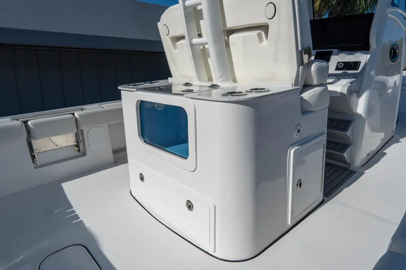 Slide: The Image of 2026 Tidewater 3100 Carolina Bay boat interior with seating and storage compartments. - 9