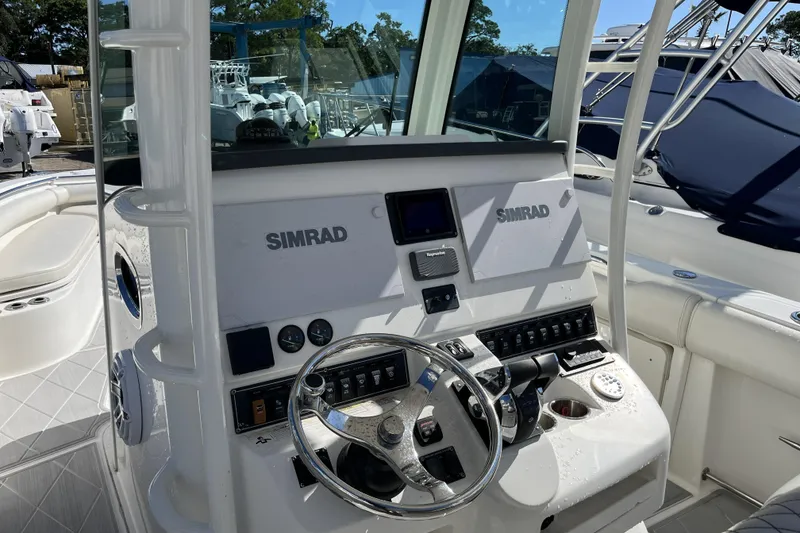 Slide: The Image of 2012 Boston Whaler 320 Outrage boat console with Simrad navigation system. - 5