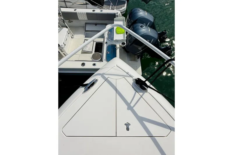 Slide: The Image of 2021 Intrepid 410 Evolution boat deck with dual Yamaha outboard engines. - 11