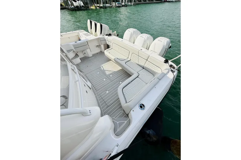 Slide: The Image of 2021 Intrepid 410 Evolution boat with spacious seating and triple outboard engines. - 14