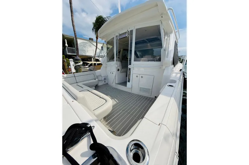 Slide: The Image of 2021 Intrepid 410 Evolution yacht with spacious deck and modern design. - 17