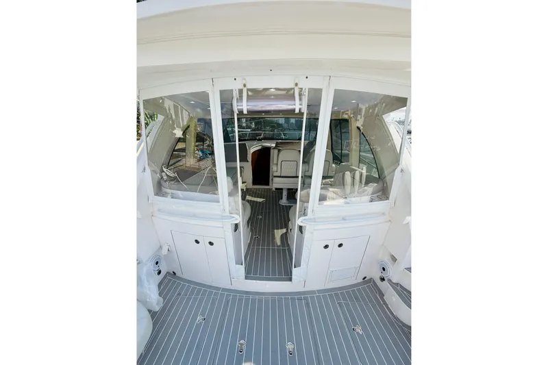 Slide: The Image of 2021 Intrepid 410 Evolution yacht interior with sleek design and modern seating. - 19