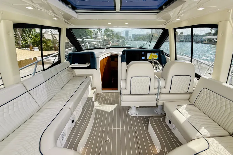 Slide: The Image of Luxurious interior of 2021 Intrepid 410 Evolution yacht with plush seating and modern helm. - 21
