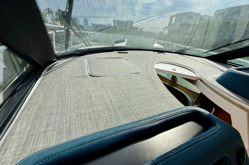 Slide: The Image of Interior view of 2021 Intrepid 410 Evolution yacht dashboard with sleek design and modern features. - 33