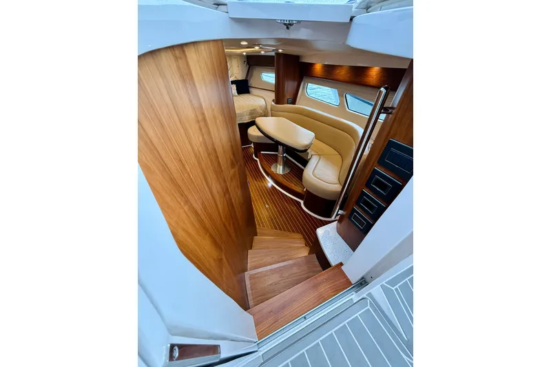 Slide: The Image of Luxurious interior of 2021 Intrepid 410 Evolution yacht with wooden finishes and plush seating. - 35