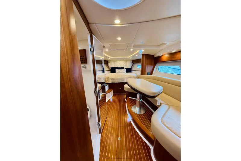 Slide: The Image of Luxurious interior of 2021 Intrepid 410 Evolution yacht with elegant wood finishes. - 36