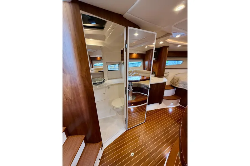 Slide: The Image of Luxurious interior of 2021 Intrepid 410 Evolution yacht with wood finishes and modern amenities. - 45