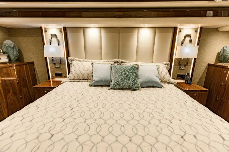 Slide: The Image of Luxurious bedroom interior on 2020 Viking 72 yacht with elegant bedding and modern decor. - 16