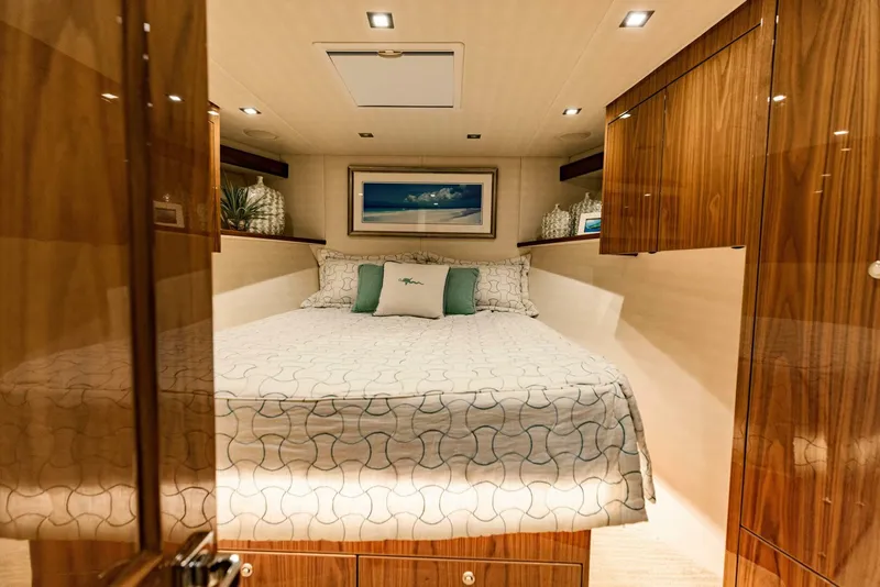 Slide: The Image of Luxurious bedroom interior of 2020 Viking 72 yacht with elegant wood finishes. - 21