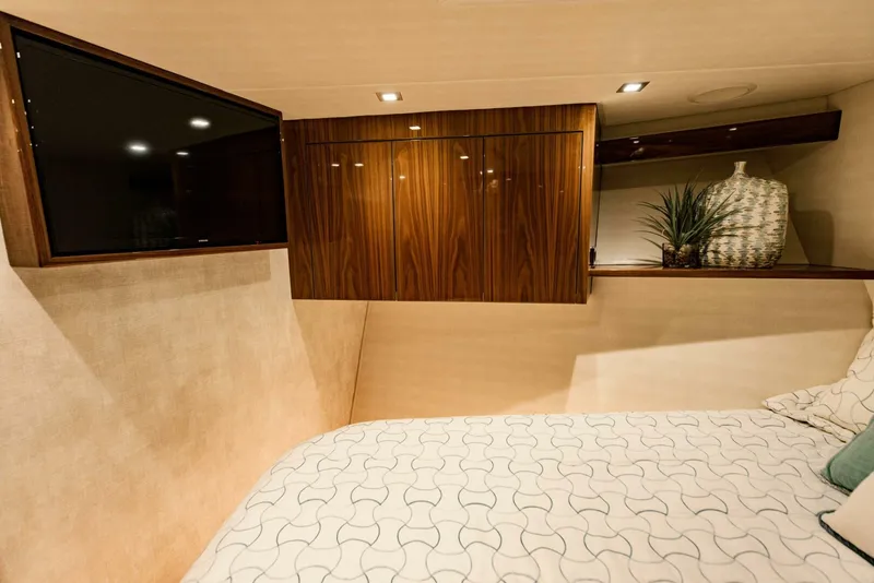 Slide: The Image of Luxurious cabin interior of 2020 Viking 72 yacht with TV and elegant decor. - 24