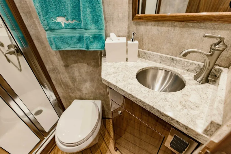 Slide: The Image of Luxurious bathroom in 2020 Viking 72 yacht with modern fixtures and elegant design. - 27