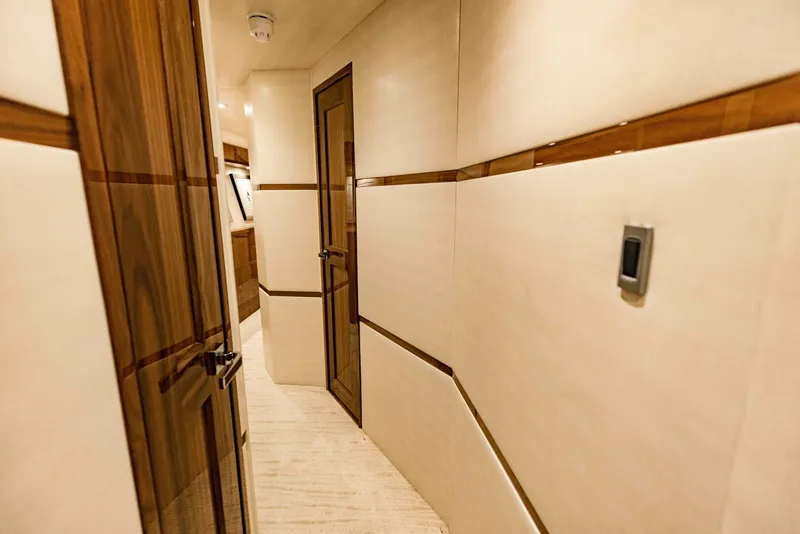 Slide: The Image of Luxurious hallway interior of 2020 Viking 72 yacht with wooden accents. - 32