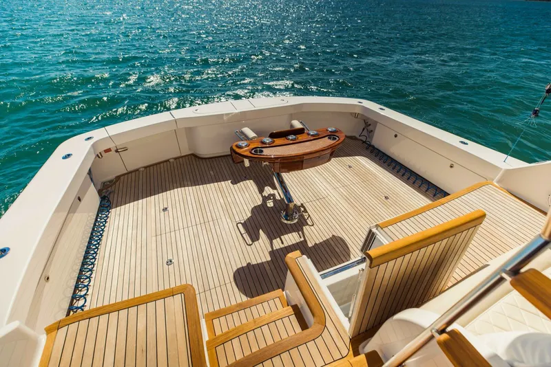 Slide: The Image of Luxurious 2020 Viking 72 yacht deck with wooden flooring and ocean view. - 39