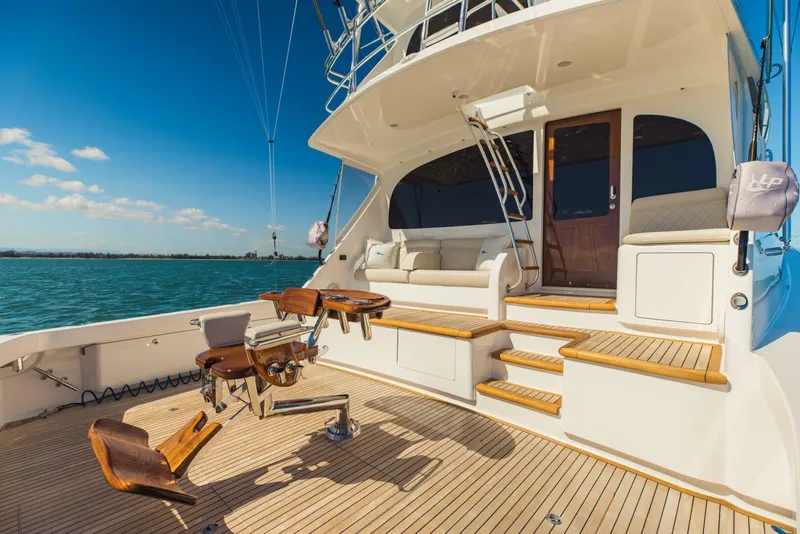 Slide: The Image of Luxurious 2020 Viking 72 yacht deck with fishing chair and seating area. - 40