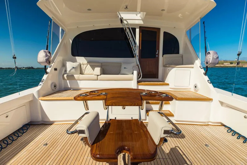 Slide: The Image of Luxurious 2020 Viking 72 yacht deck with seating and fishing equipment. - 42