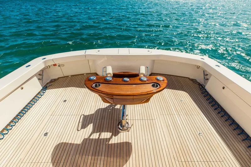 Slide: The Image of Viking 72 yacht deck, 2020 model, with wooden table overlooking the ocean. - 43