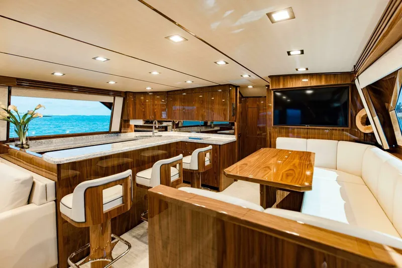 Slide: The Image of Luxurious interior of 2020 Viking 72 yacht with modern kitchen and dining area. - 8