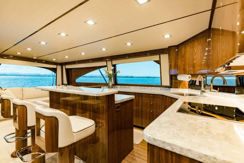 Slide: The Image of Luxurious interior of 2020 Viking 72 yacht with elegant wood finishes and ocean view. - 9