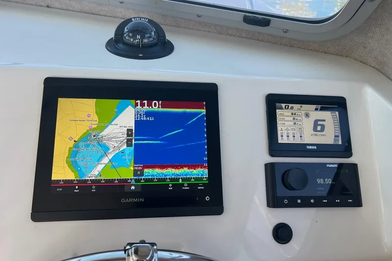 Slide: The Image of Dashboard of 2023 Parker 2520 XLD Sport Cabin with Garmin and Yamaha displays. - 5