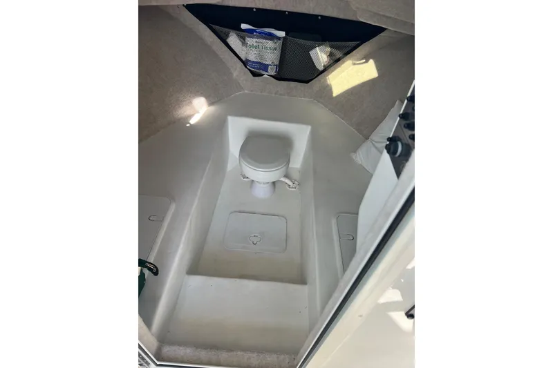 Slide: The Image of 2023 Parker 2520 XLD Sport Cabin interior with compact marine toilet. - 7