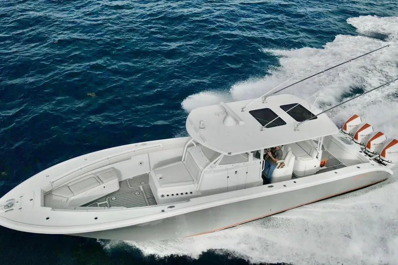 The Image of 2015 Yellowfin 42 Offshore boat cruising on open water, showcasing sleek design and powerful engines. - 1