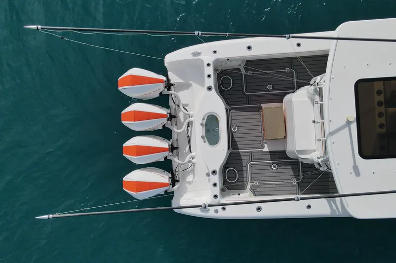 Slide: The Image of Overhead view of 2015 Yellowfin 42 Offshore boat with four outboard motors. - 3