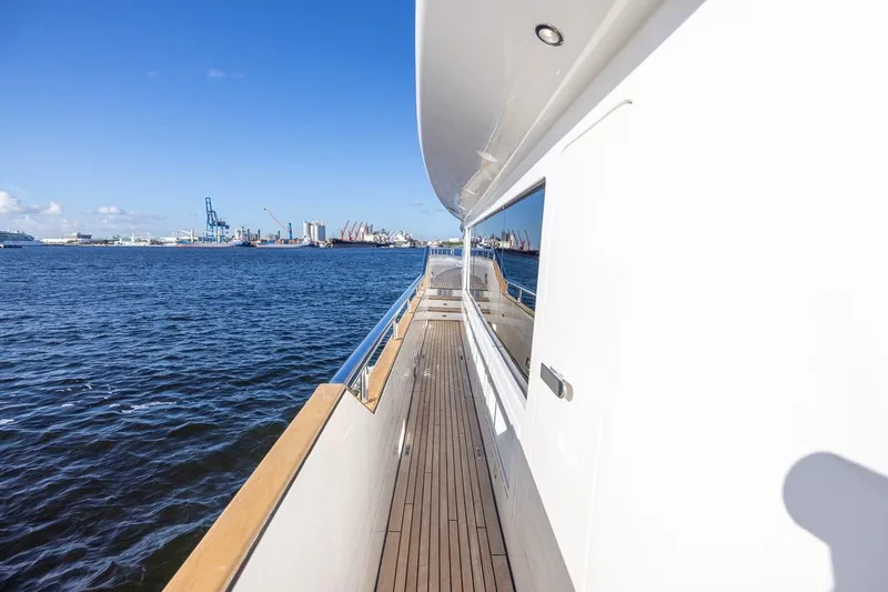 Slide: The Image of Side deck view of 2003 Johnson 87' Motor Yacht on open water. - 17