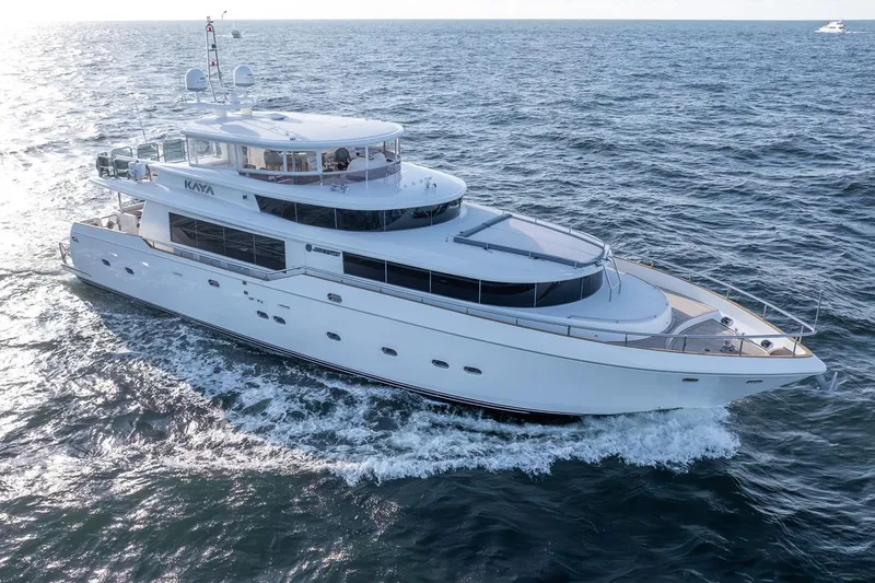 Slide: The Image of Luxurious 2003 Johnson 87' Motor Yacht cruising on open sea. - 2