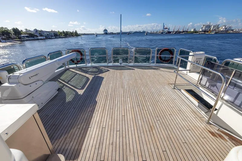 Slide: The Image of Spacious deck of 2003 Johnson 87' Motor Yacht with ocean view and clear skies. - 20