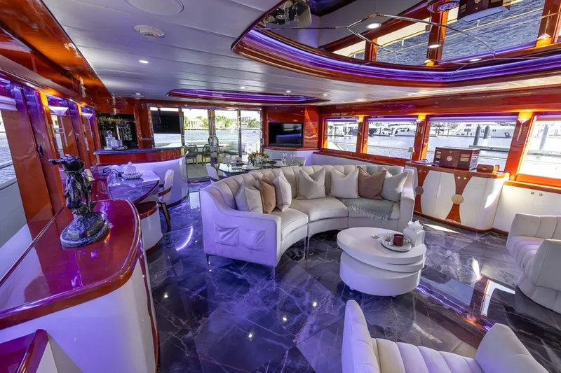 Slide: The Image of Luxurious interior of a 2003 Johnson 87' Motor Yacht with elegant seating and modern decor. - 22