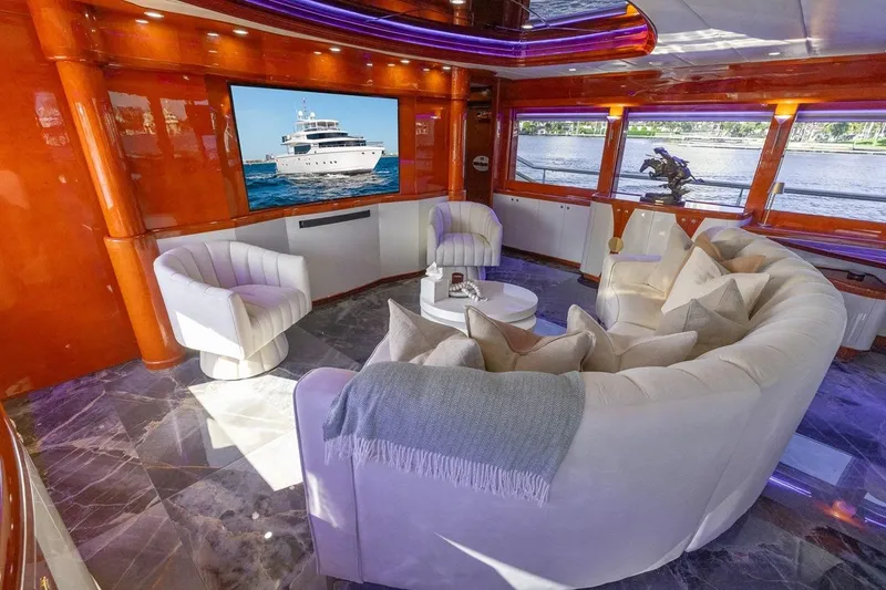 Slide: The Image of Luxurious interior of 2003 Johnson 87' Motor Yacht with elegant seating and large windows. - 24