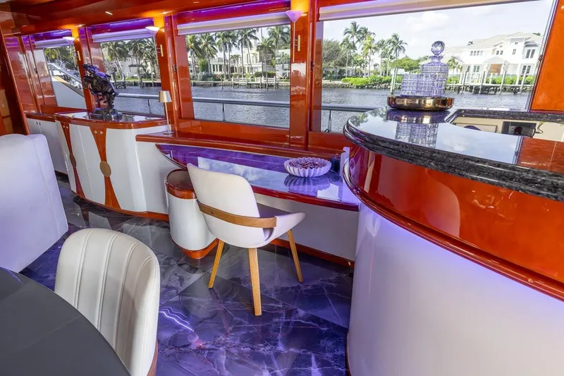 Slide: The Image of Luxurious interior of 2003 Johnson 87' Motor Yacht with elegant seating and waterfront view. - 29