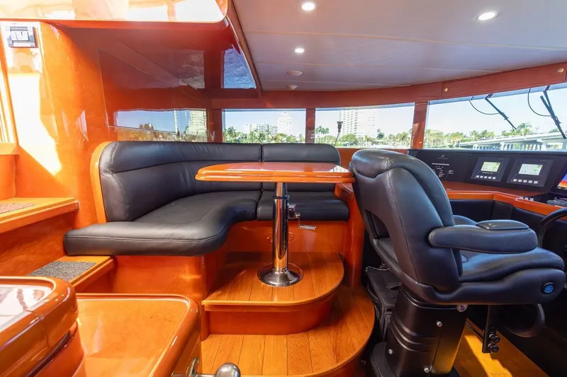 Slide: The Image of Luxurious interior of 2003 Johnson 87' Motor Yacht with leather seating and modern controls. - 33