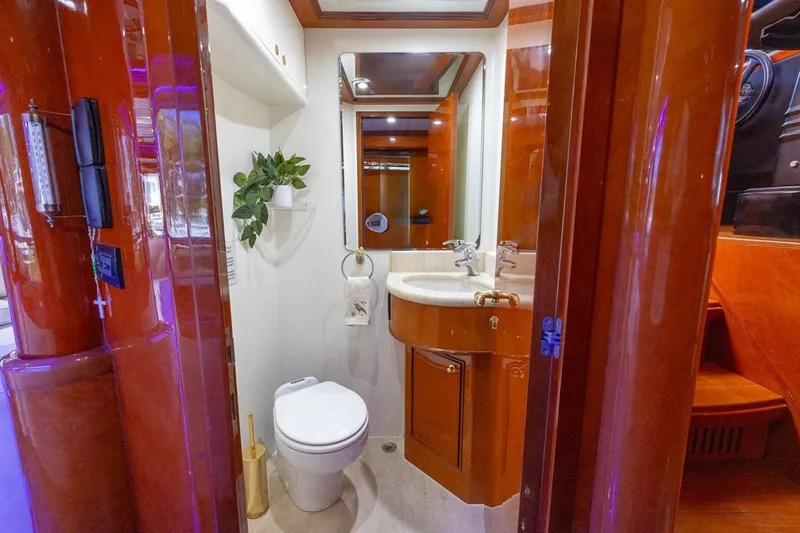 Slide: The Image of Luxurious bathroom in 2003 Johnson 87' Motor Yacht with elegant wood finishes. - 39
