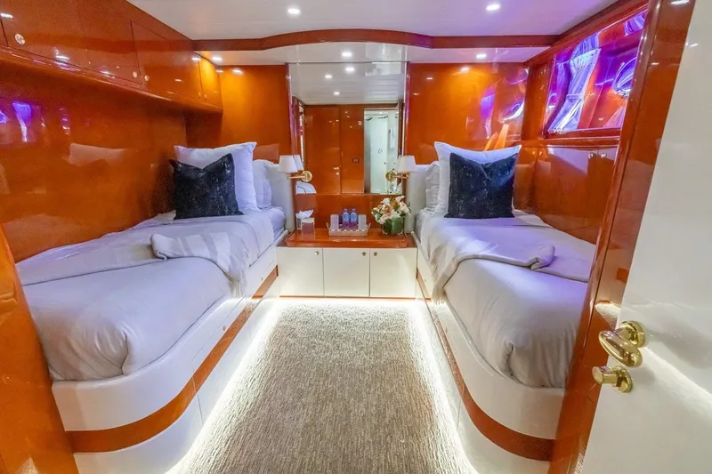Slide: The Image of Luxurious twin cabin interior of 2003 Johnson 87' Motor Yacht with elegant wood finish. - 43
