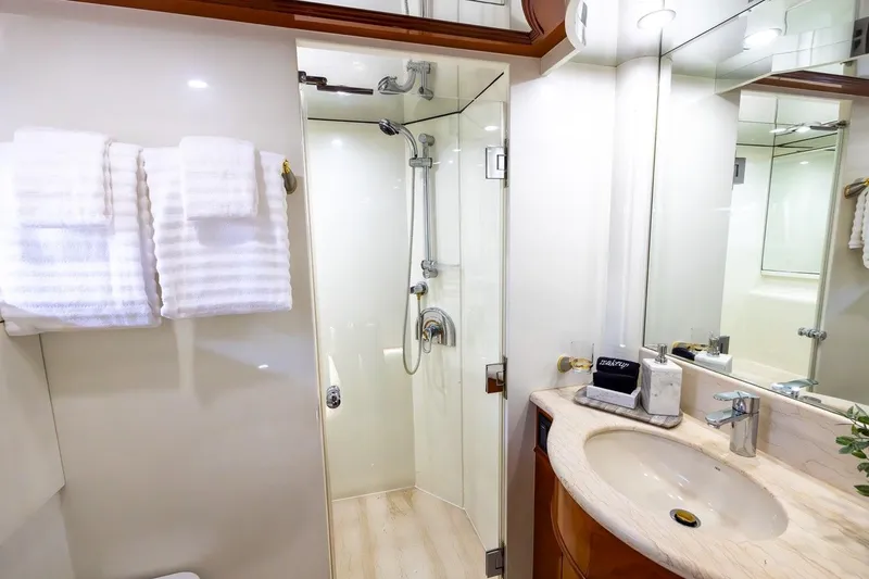 Slide: The Image of Luxurious bathroom on 2003 Johnson 87' Motor Yacht with shower and elegant sink. - 44