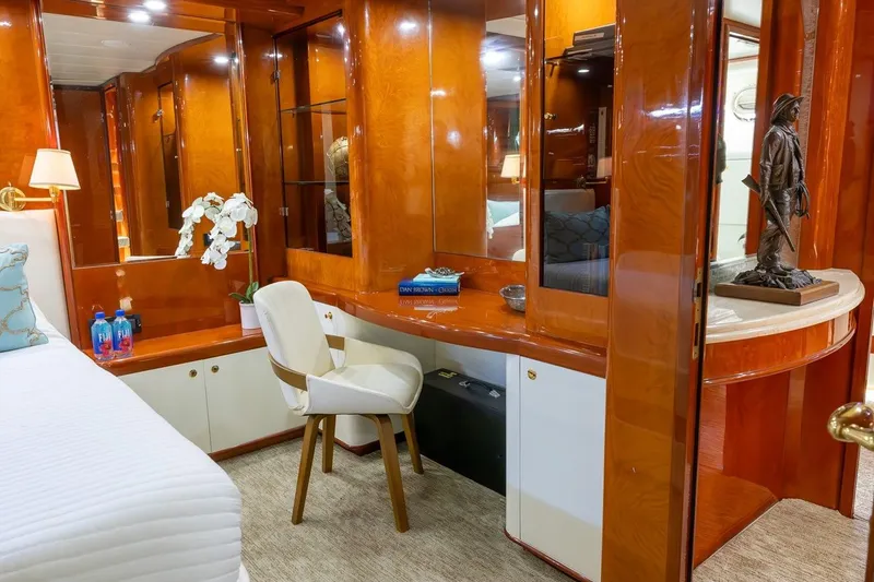 Slide: The Image of Luxurious interior of 2003 Johnson 87' Motor Yacht with elegant wood finishes and decor. - 46