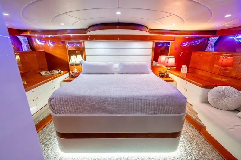 Slide: The Image of Luxurious bedroom interior of 2003 Johnson 87' Motor Yacht with elegant lighting and wood finishes. - 50