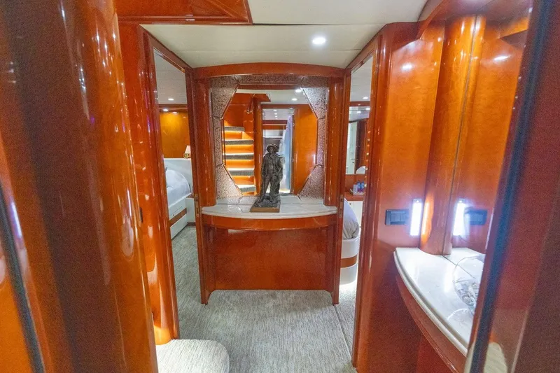 Slide: The Image of Luxurious interior of a 2003 Johnson 87' Motor Yacht with elegant wood finishes. - 52