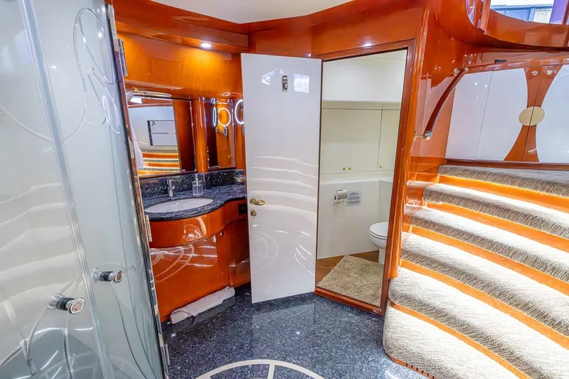 Slide: The Image of Luxurious bathroom interior of 2003 Johnson 87' Motor Yacht with elegant wood finishes. - 53