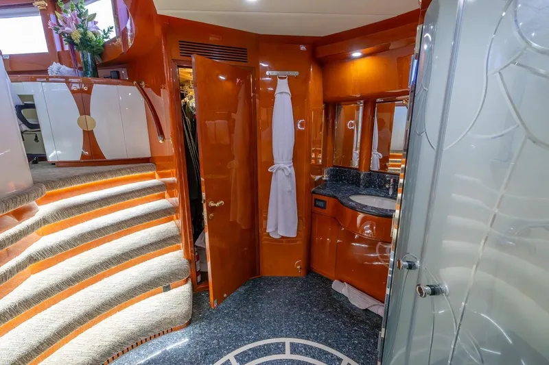 Slide: The Image of Luxurious interior of 2003 Johnson 87' Motor Yacht with elegant wood finishes and modern amenities. - 54