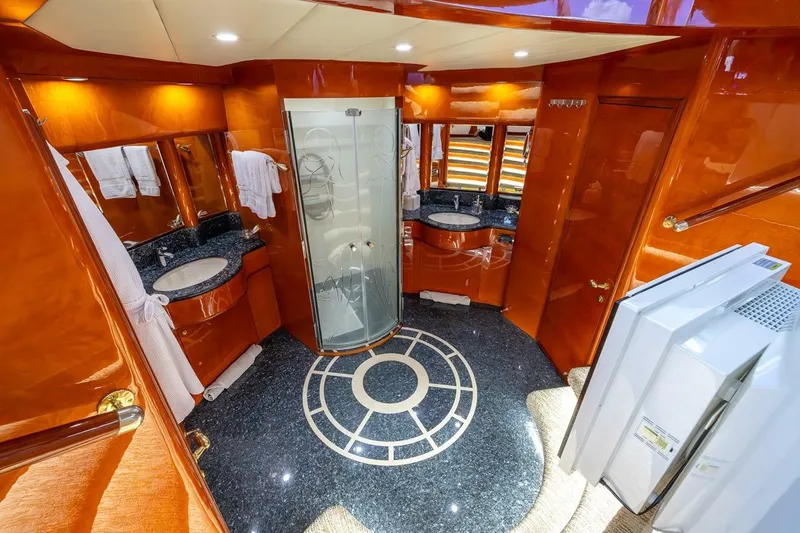 Slide: The Image of Luxurious bathroom interior of 2003 Johnson 87' Motor Yacht with elegant wood and granite finishes. - 56