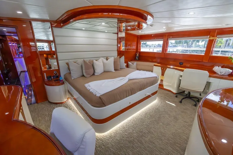 Slide: The Image of Luxurious bedroom interior of 2003 Johnson 87' Motor Yacht with elegant furnishings. - 58