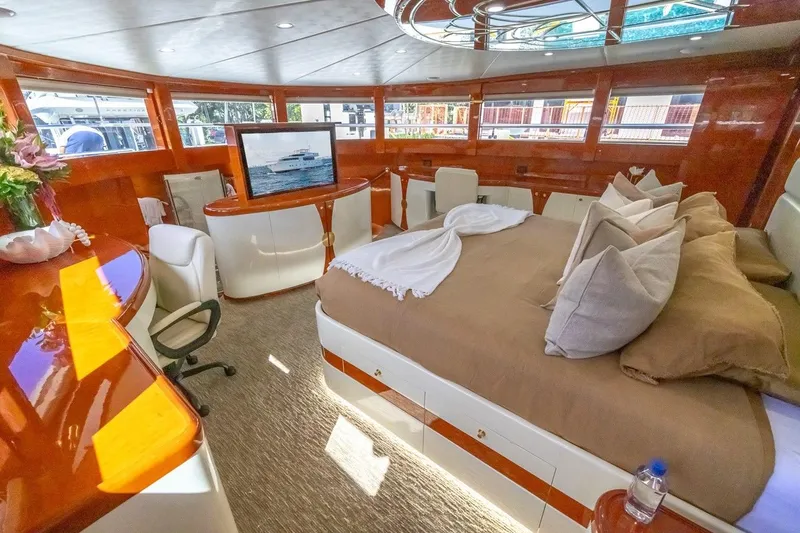 Slide: The Image of Luxurious interior of 2003 Johnson 87' Motor Yacht with elegant furnishings and large windows. - 59