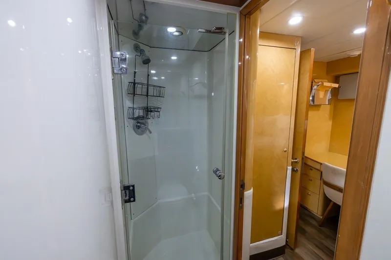 Slide: The Image of Luxurious bathroom interior on 2003 Johnson 87' Motor Yacht, featuring a modern shower. - 64