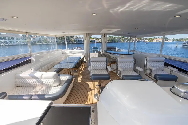 Slide: The Image of Luxurious interior of 2003 Johnson 87' Motor Yacht with elegant seating and scenic water views. - 74