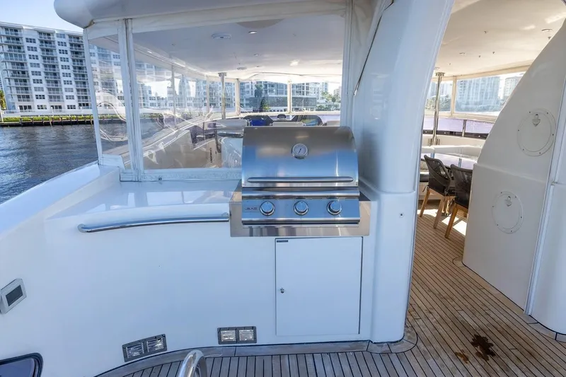 Slide: The Image of Outdoor grill on 2003 Johnson 87' Motor Yacht deck with waterfront view. - 78