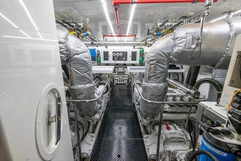 Slide: The Image of Engine room of a 2003 Johnson 87' Motor Yacht with advanced machinery and controls. - 82