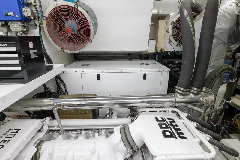 Slide: The Image of Engine room of 2003 Johnson 87' Motor Yacht with visible machinery and ventilation system. - 84